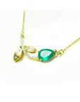 1.66 carat pear-cut natural emerald necklace in 14K yellow gold with diamond accents and leaf design.