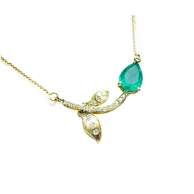 Pear cut natural emerald necklace 1.66 carats sourced from Muzo mines; nature inspired design handcrafted in 14k yellow gold