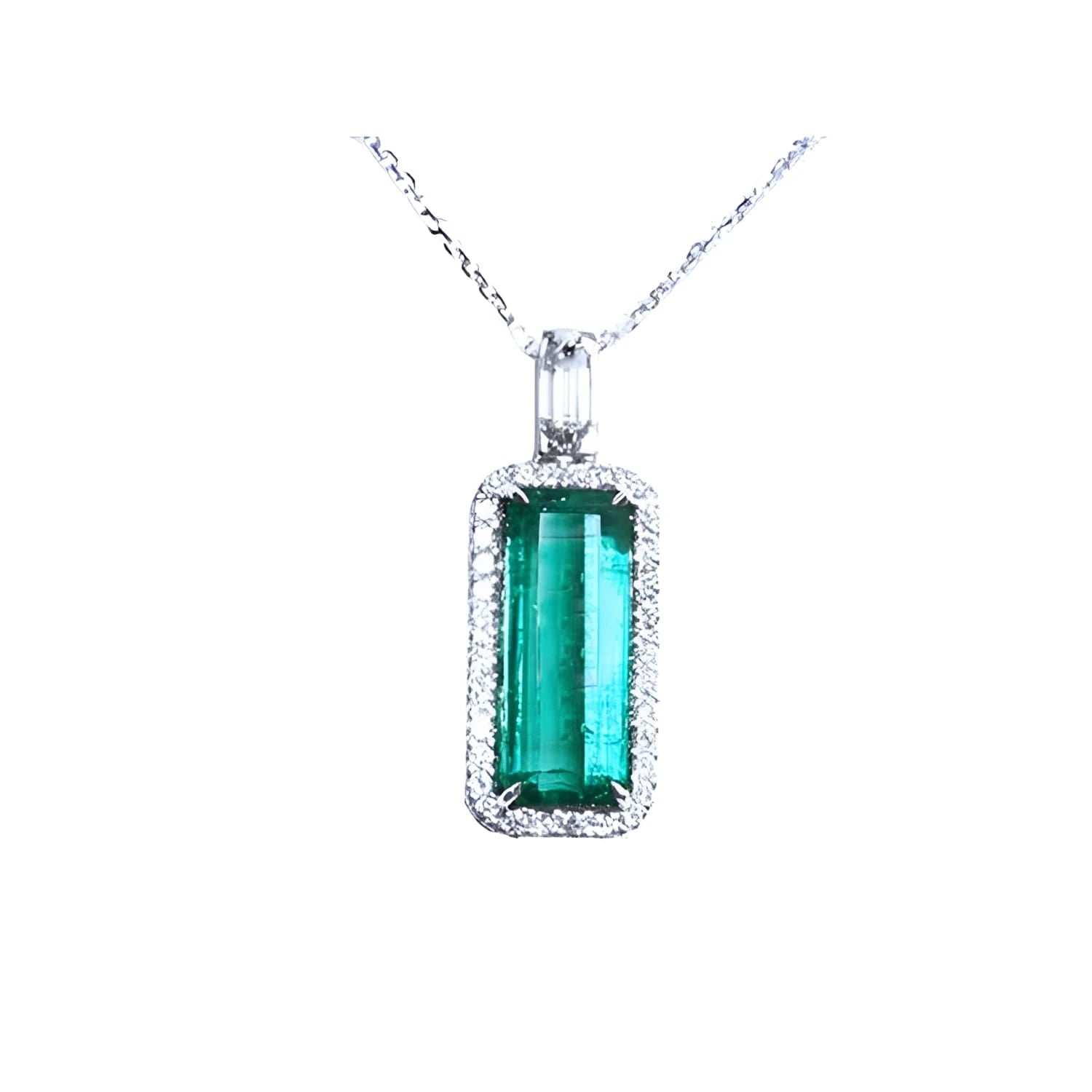 Elongated natural emerald pendant with halo diamonds on an 18K white gold chain.