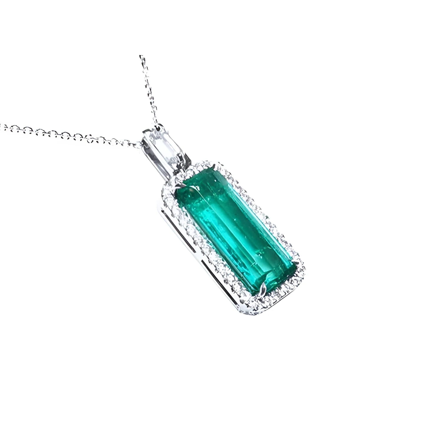 Elongated natural emerald pendant with halo diamonds in 18K white gold.