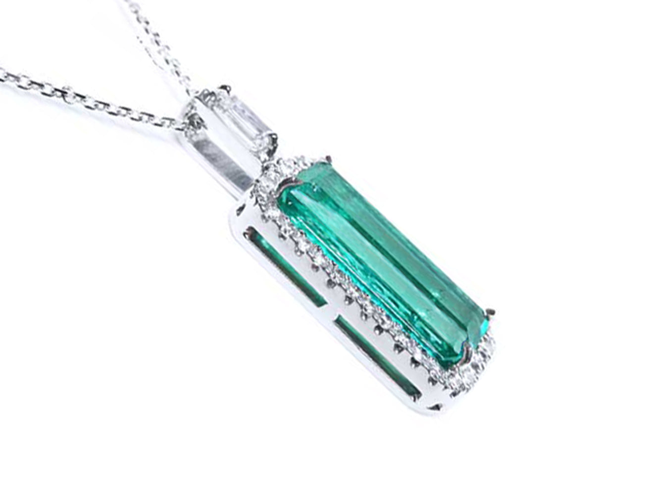 An elongated emerald pendant with side galley view.