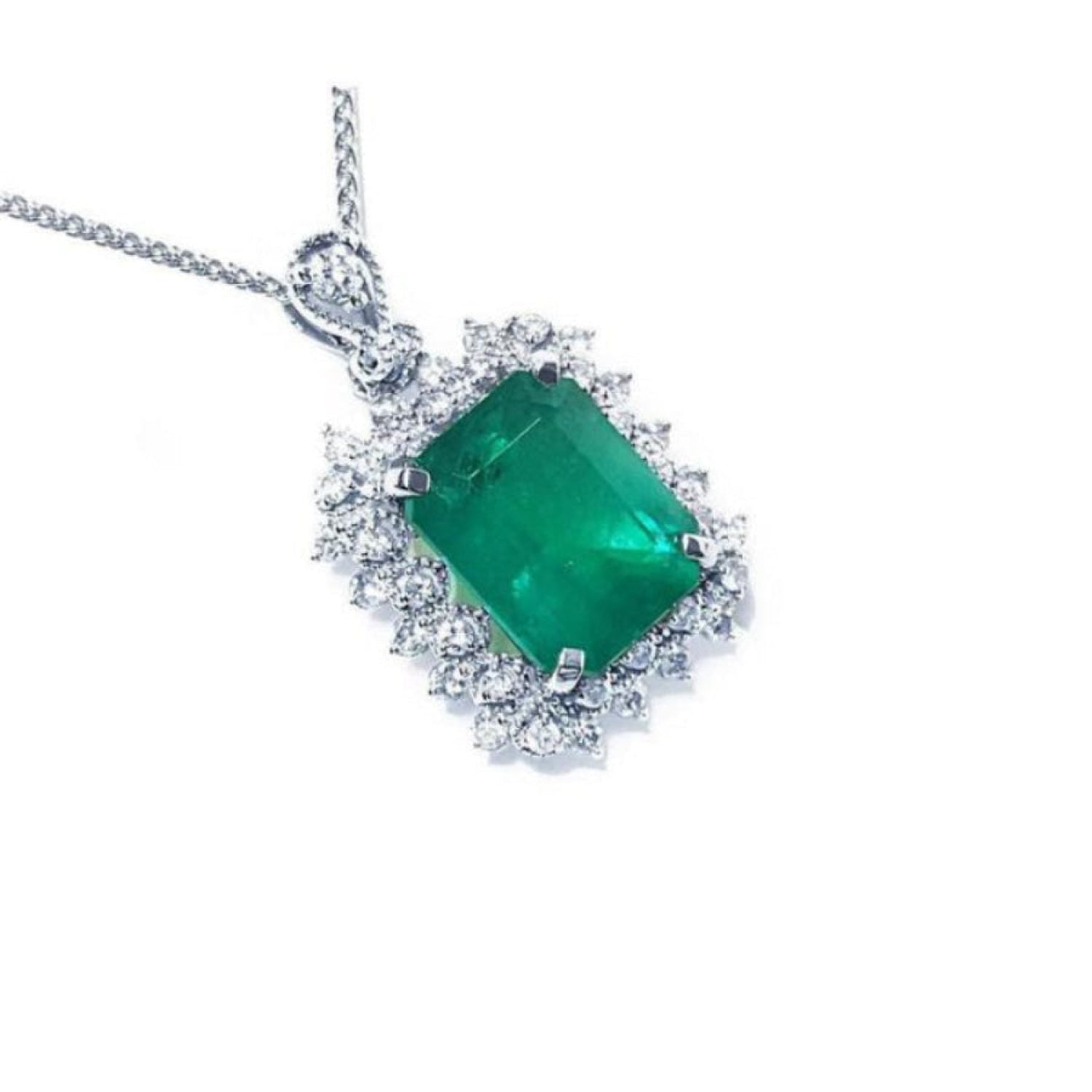A Colombian emerald pendant necklace with halo natural diamond in 14k white gold topside view.