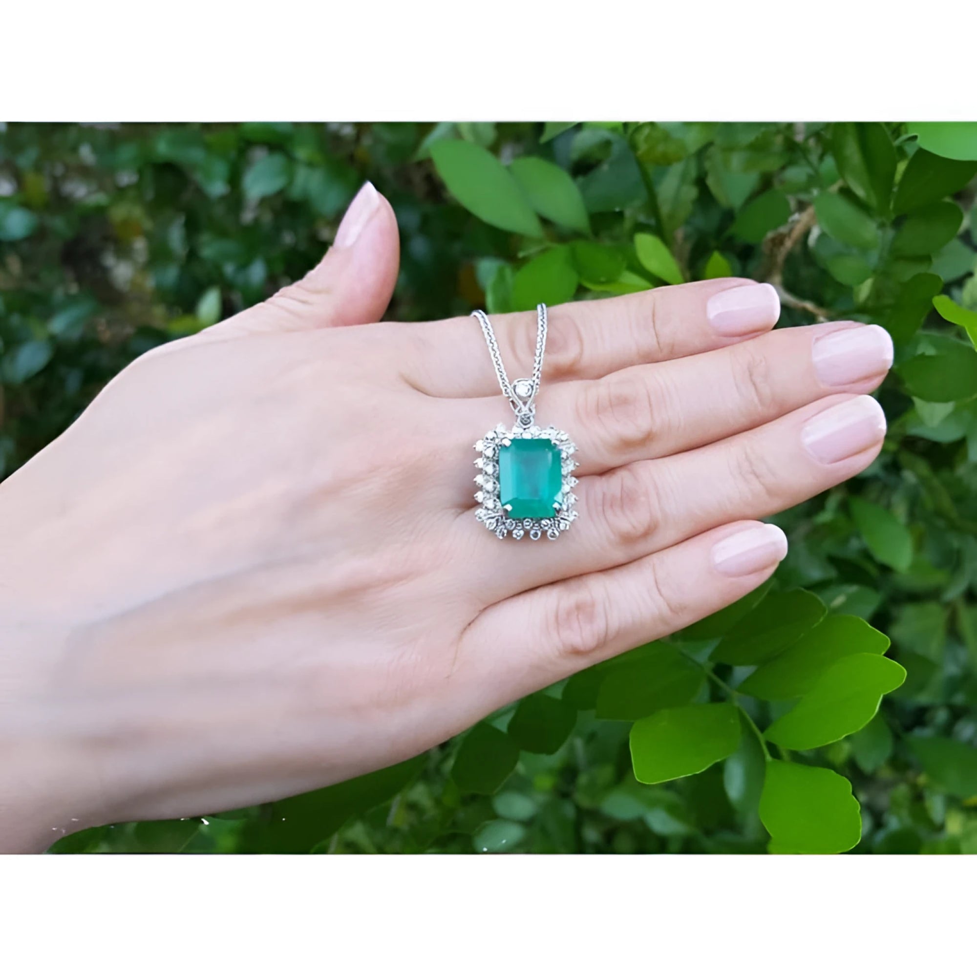 7.78 ct. natural emerald pendant with halo diamonds in 14K white gold, antique-inspired design.