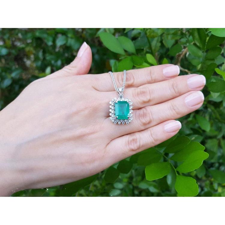 7.78 ct. natural emerald pendant with halo diamonds in 14K white gold, antique-inspired design.