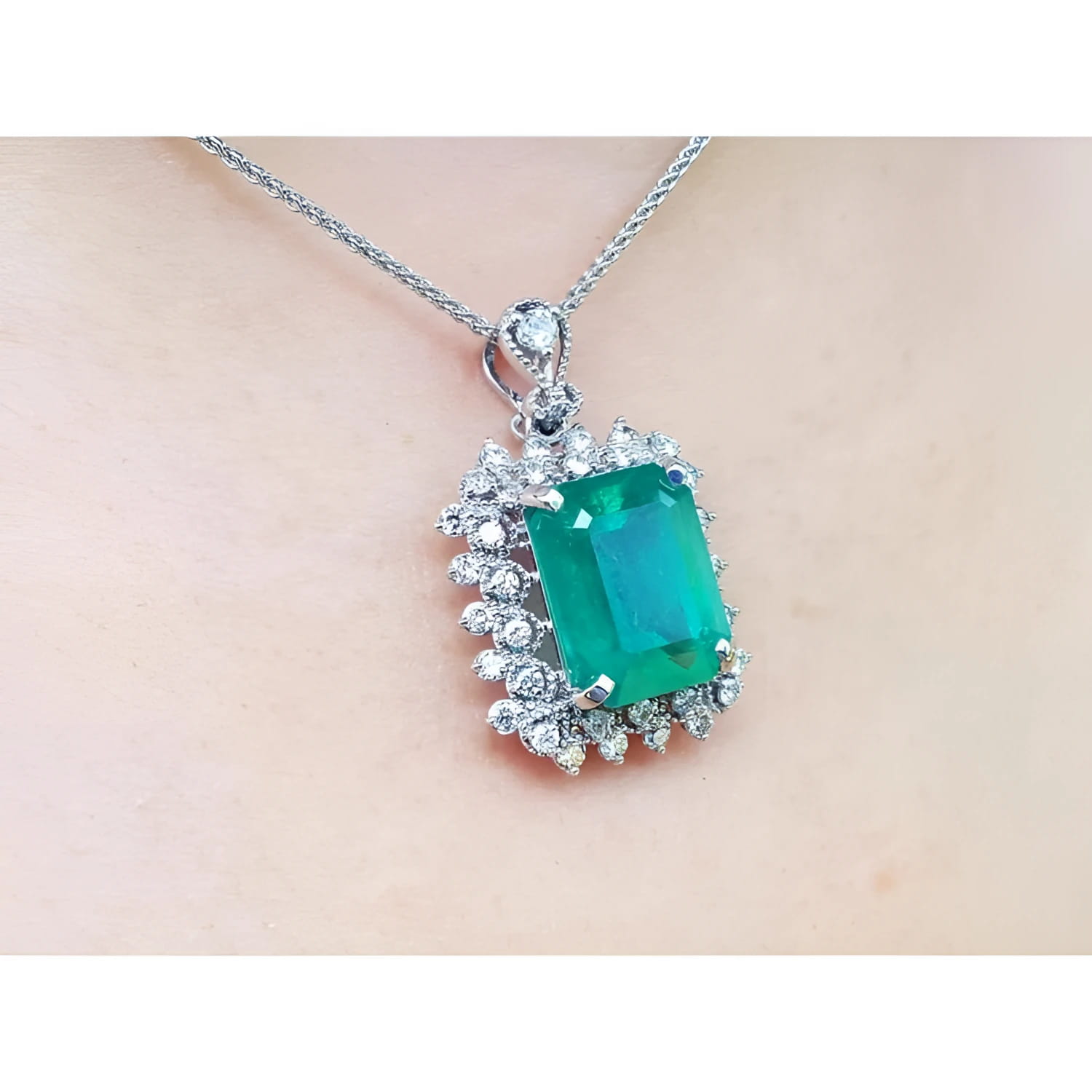 7.78 ct. natural emerald pendant with deep green rectangular stone, double halo diamonds, 14K white gold, antique style.