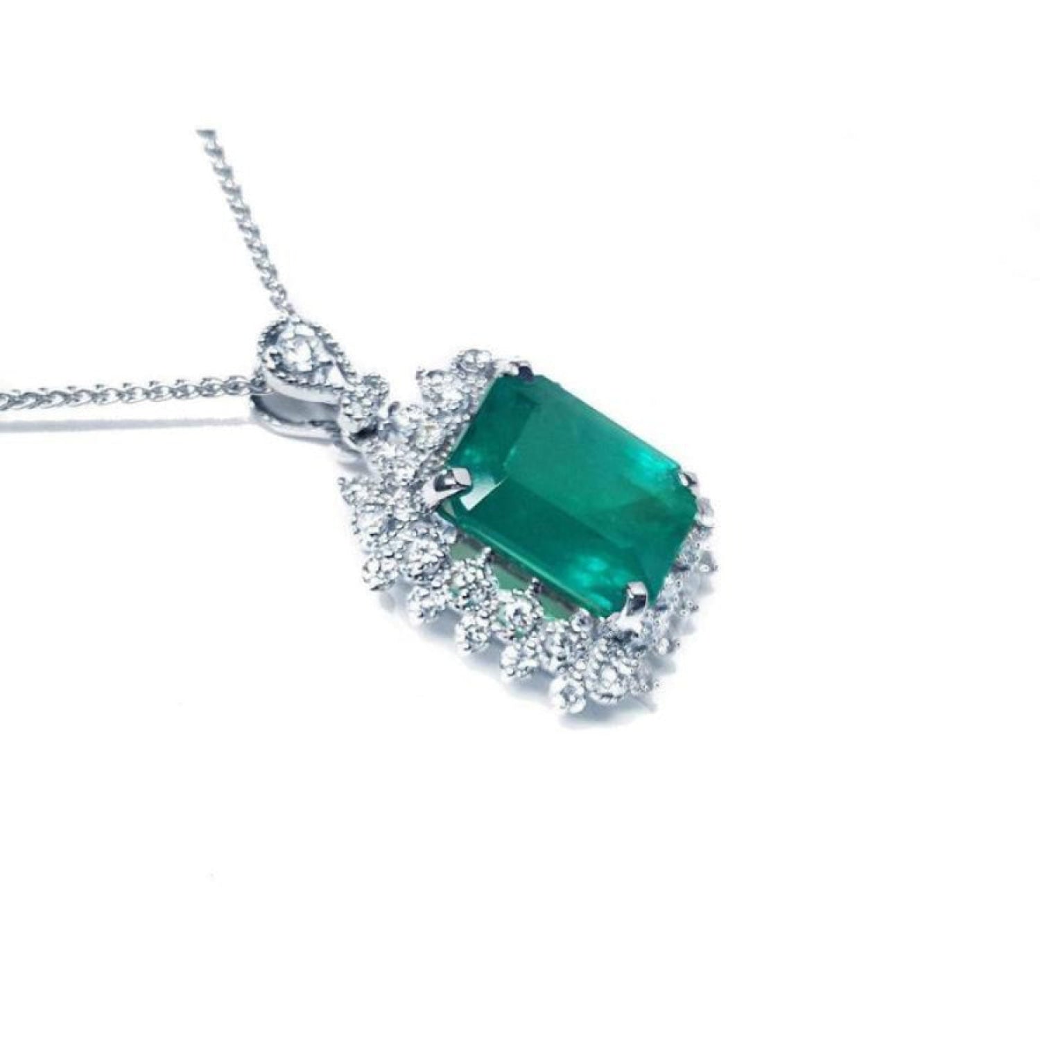 7.78 ct. deep green rectangular emerald pendant with double halo diamonds on a 14K white gold chain.