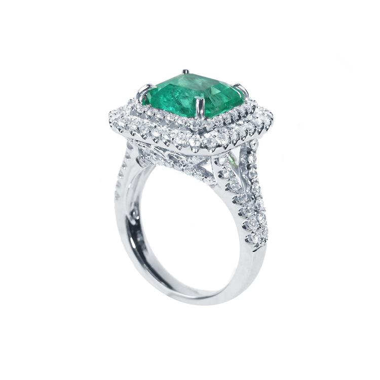 4.14 ct GIA F1 Colombian emerald ring with bright green emerald, diamond halo, and diamond-accented 14K white gold band.