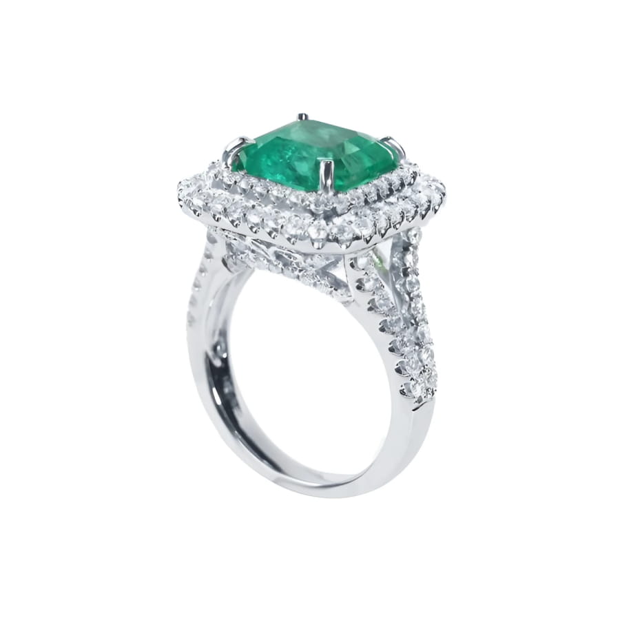 4.14 ct GIA F1 Colombian emerald ring with bright green emerald, diamond halo, and diamond-accented 14K white gold band.