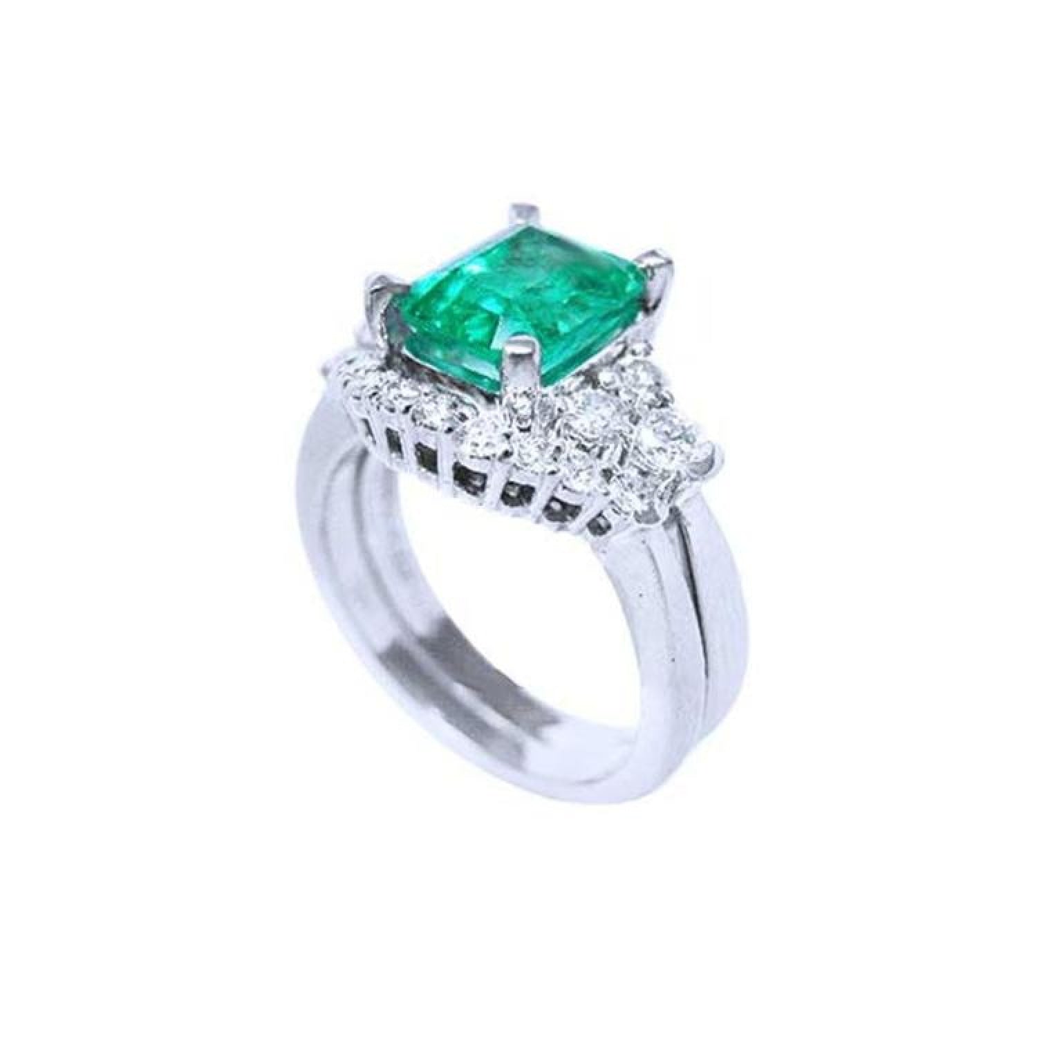 1.80 ct natural emerald ring with matching band in 14K white gold, flanked by diamonds.