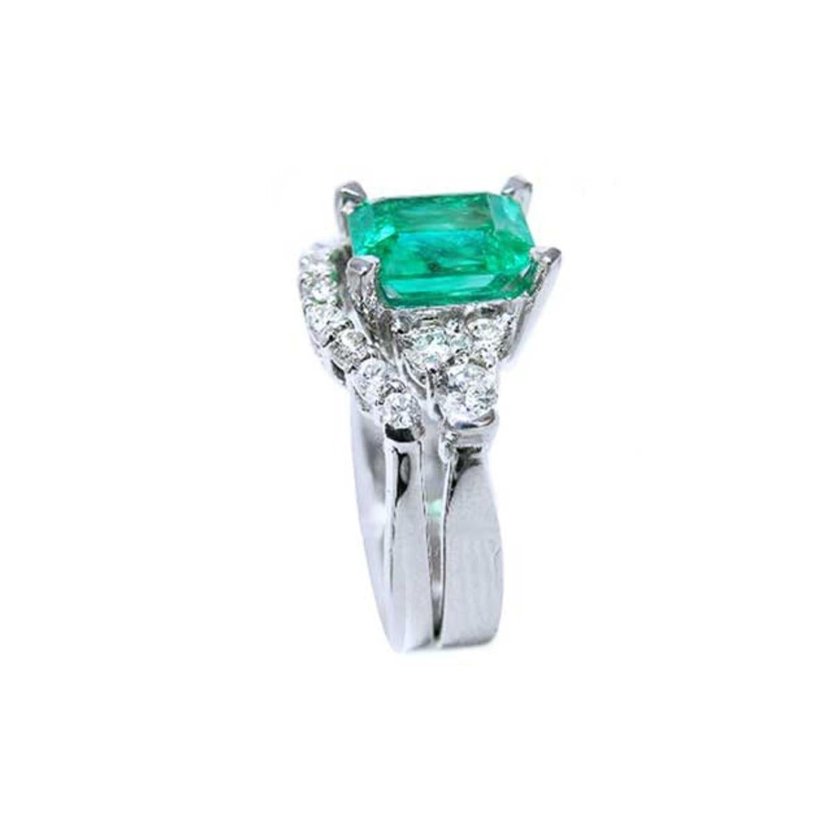 Side profile of the square emerald on top, side diamonds and band ring with the matching band together.