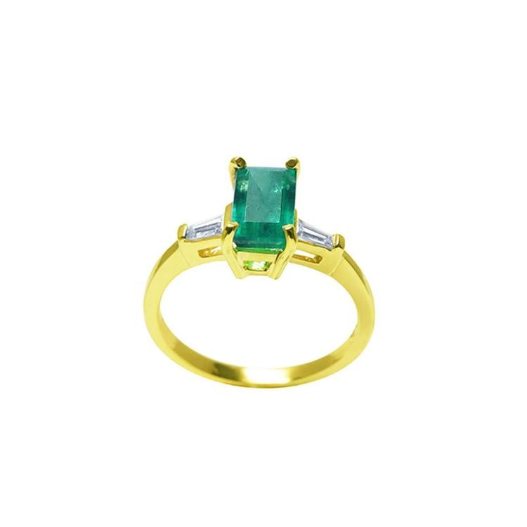 1.05 ct natural emerald ring with side baguette diamonds in 14K yellow gold.