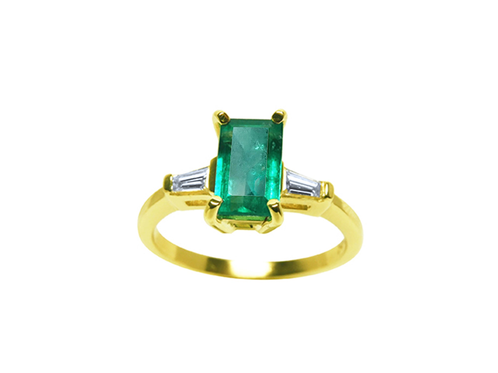 A 14k yellow gold ring with an emerald and two side baguette diamonds on a white background.