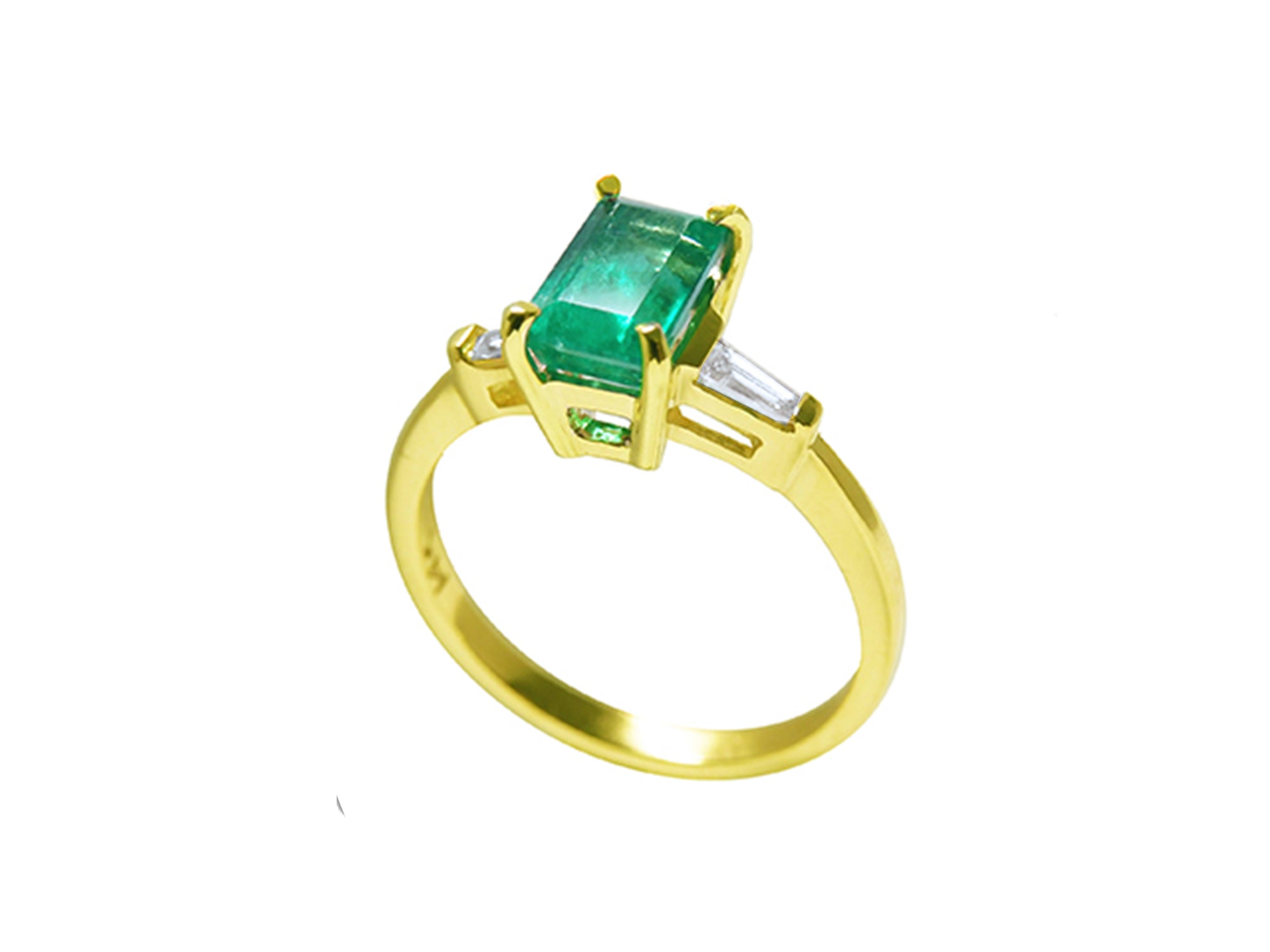 A 14k yellow gold ring with a genuine emerald side profile on a white background.