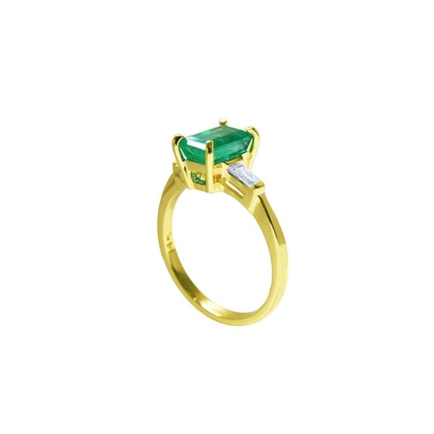 1.05 ct. natural emerald ring with side baguette diamonds in 14K yellow gold.