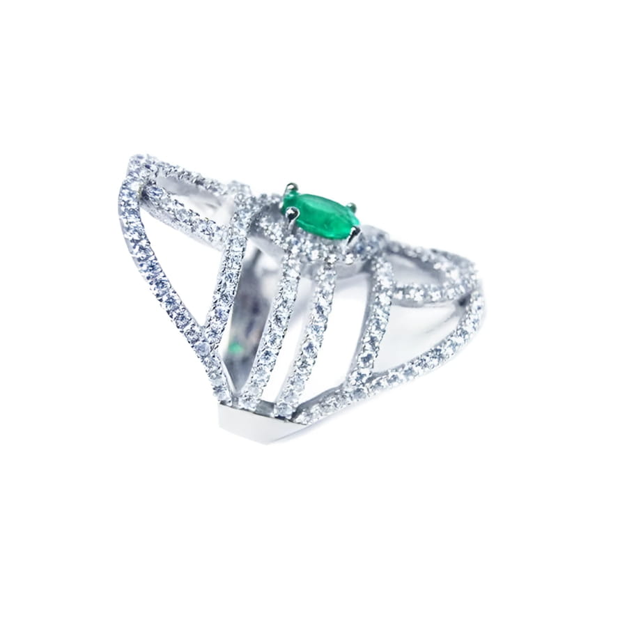 A silver ring with natural emerald center stone and diamond accents on a white background.