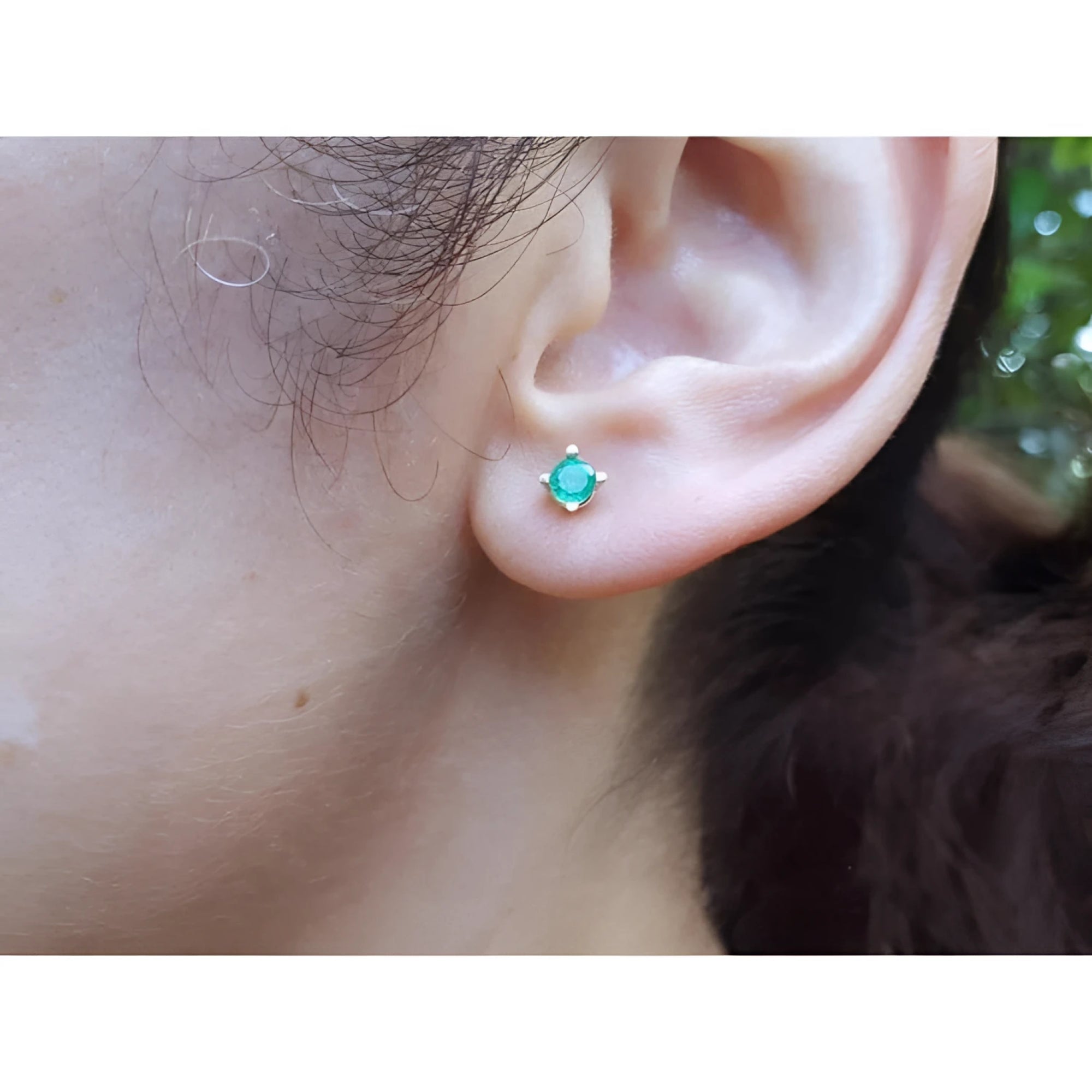 Girls' 14K gold stud earring with a round natural Colombian emerald.