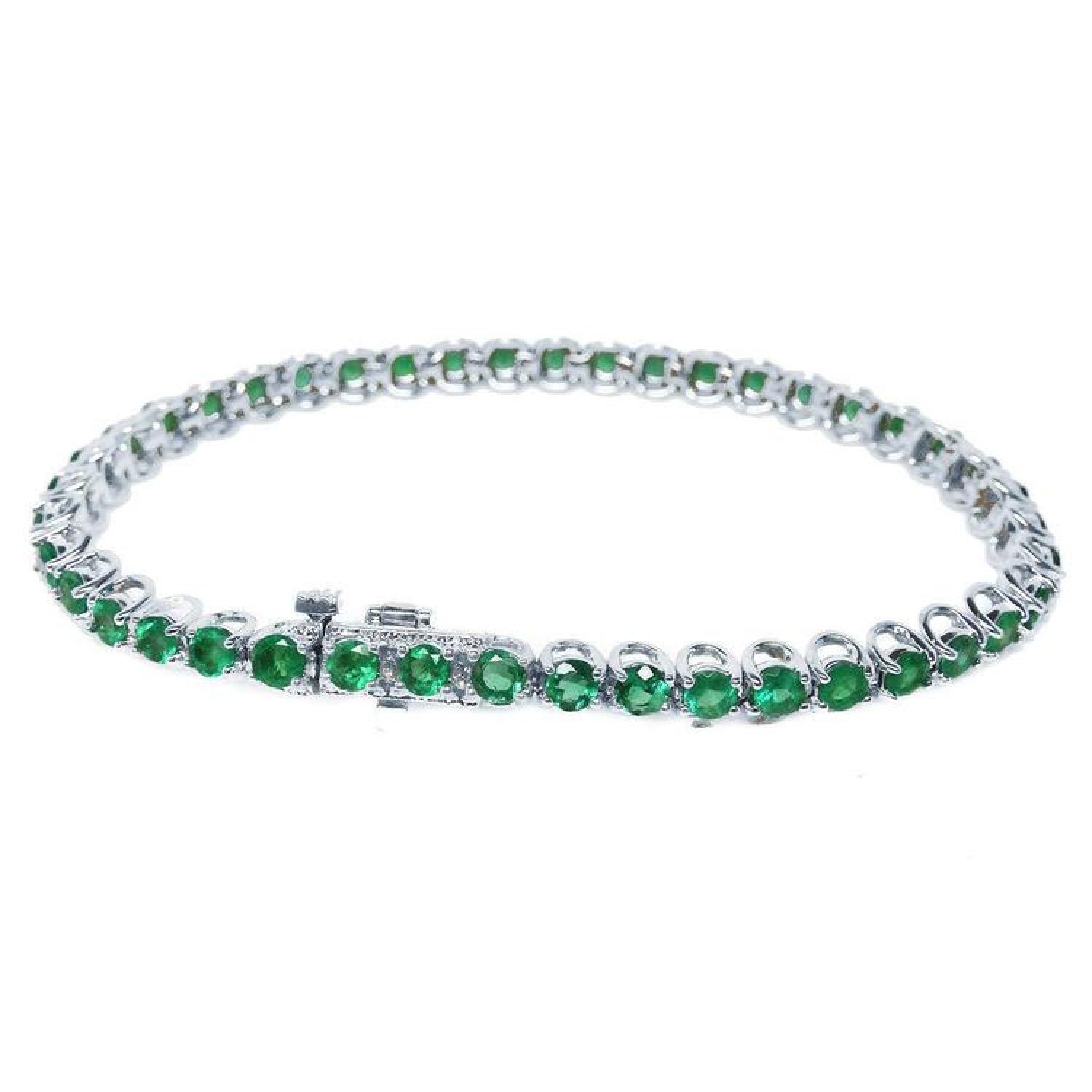Colombian emerald tennis bracelet with round green emeralds in 14K white gold.