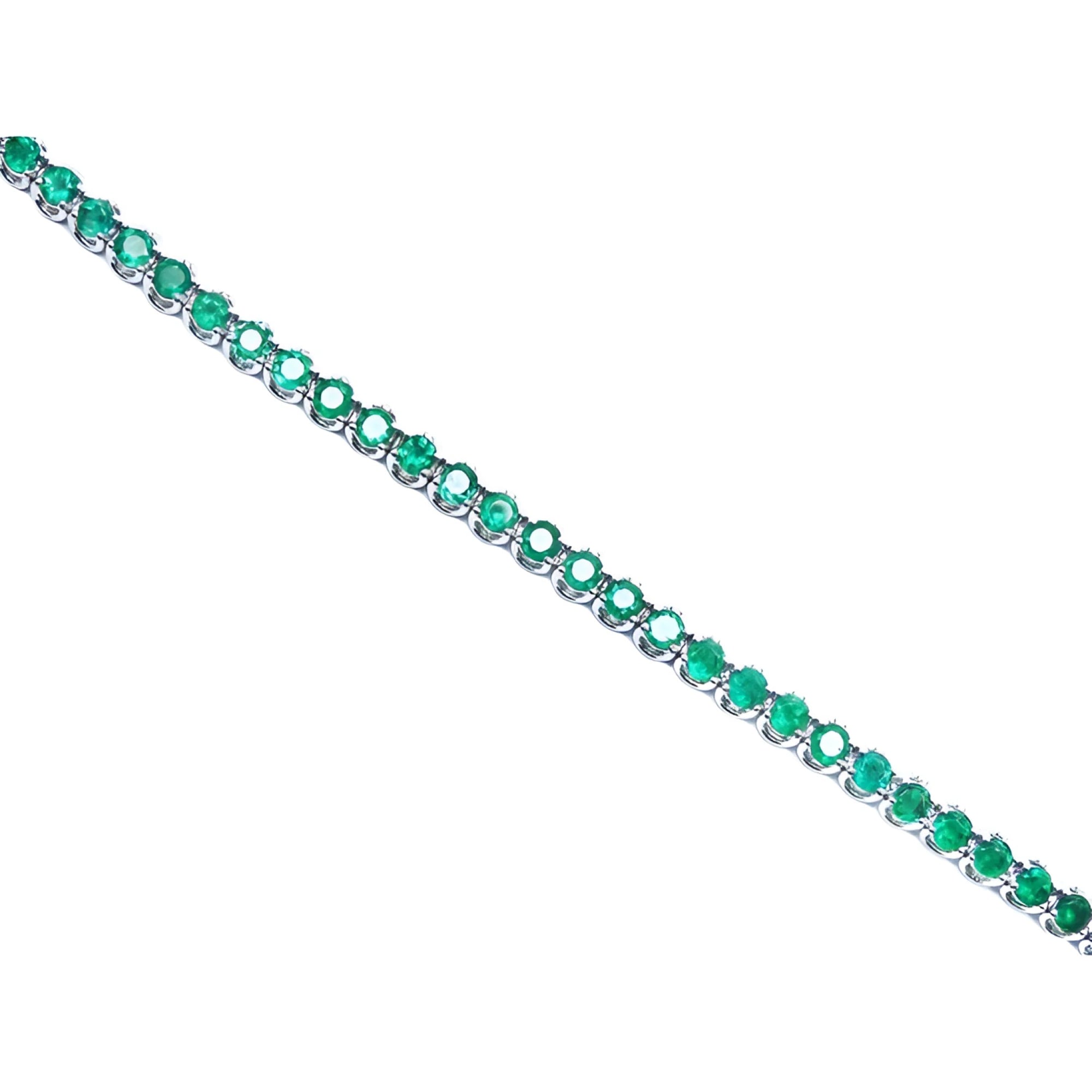 Colombian emerald tennis bracelet with round cut, deep green emeralds in 14K white gold.
