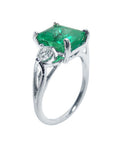 This emerald ring displays its right-side, top, side diamond and band profile.