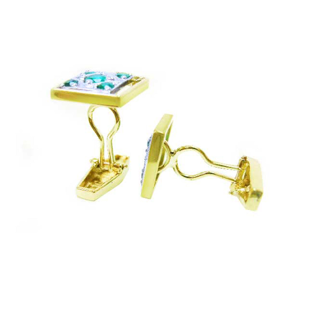 The side view of a pair of men&#39;s emerald cufflinks, crafted in 14K yellow gold.