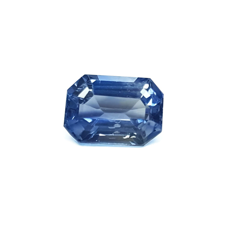 Natural loose sapphire emerald-cut, a vibrant medium blue hue gemstone with exceptional light reflection. 