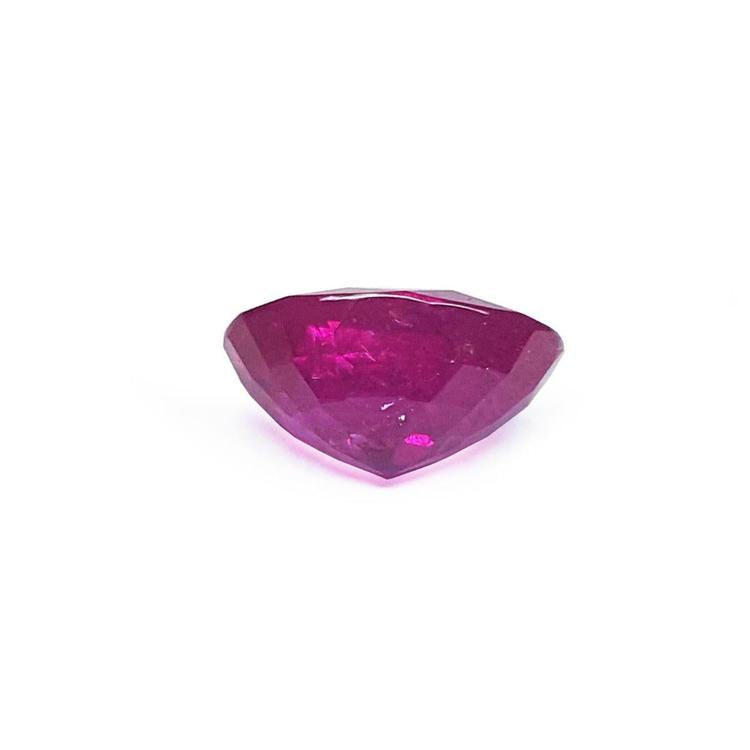 Loose natural ruby oval cut certified, underside view girdle and pavilion visibles