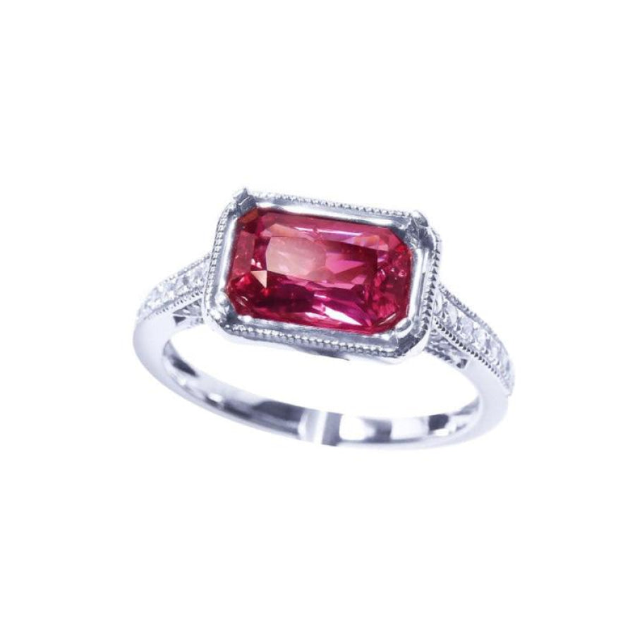 GIA certified 1.38 ct. fancy cut purplish pink sapphire ring with diamond accents on a white gold band.