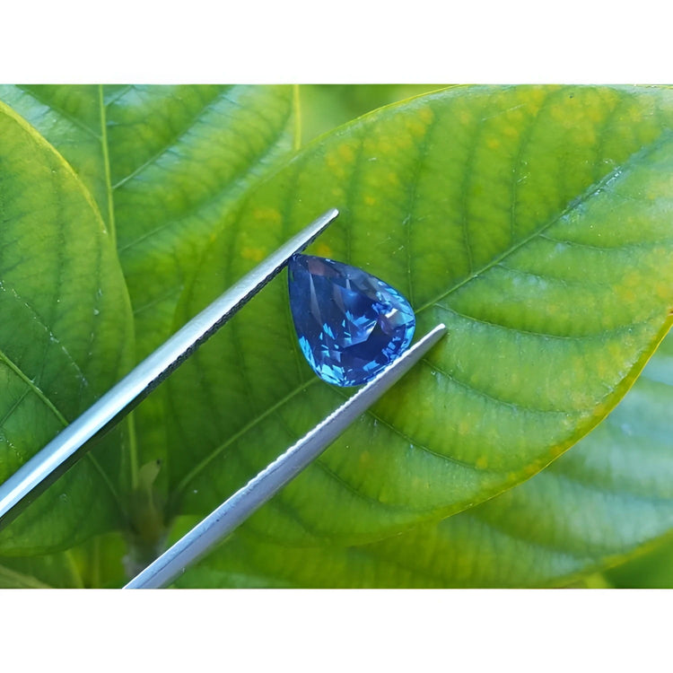 3.67 ct. Loose natural blue sapphire pear cut, showcases a vivid, deep blue hue with remarkable brilliance.