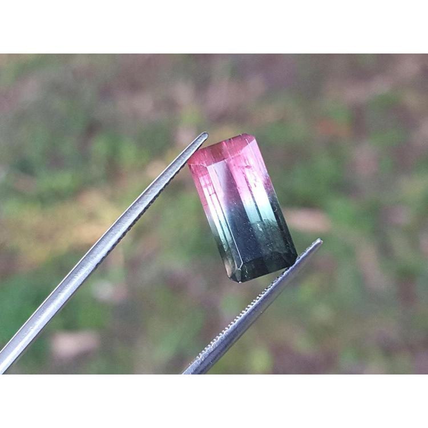 Emerald cut 6.11 ct natural loose watermelon tourmaline, deep bluish green and red orange.