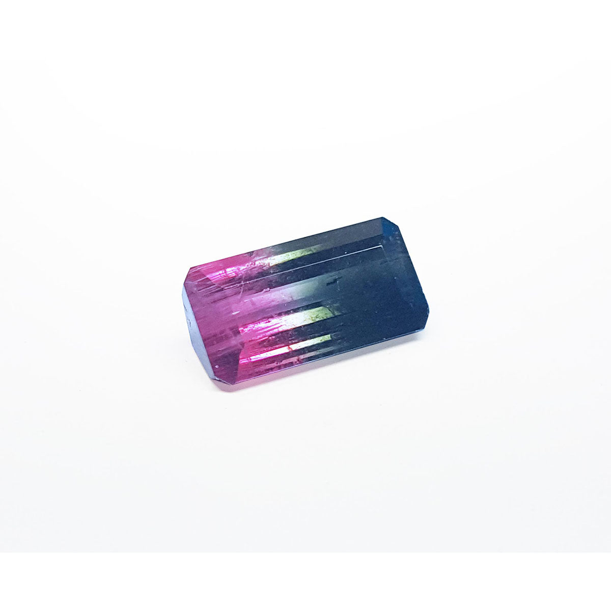 Rectangular Brazilian tourmaline with pink and blue gradient on a right side position.