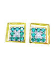 These cufflinks display round cut natural emeralds surrounding a diamond in a yellow gold frame.
