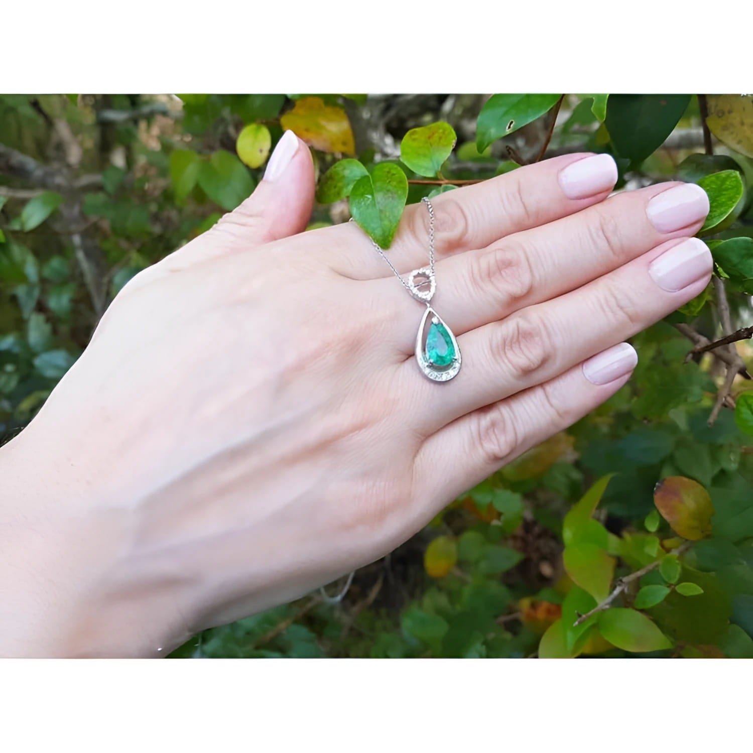 1.35 ct natural emerald pear pendant necklace with diamond bail on 14K white gold chain.