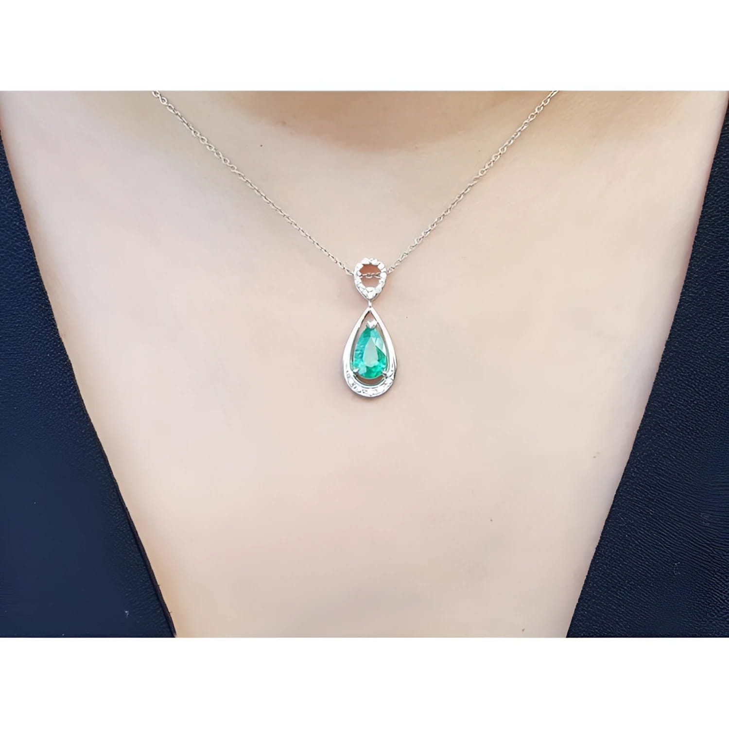 1.35 ct natural emerald pear pendant necklace with diamond bail on 14K white gold chain.