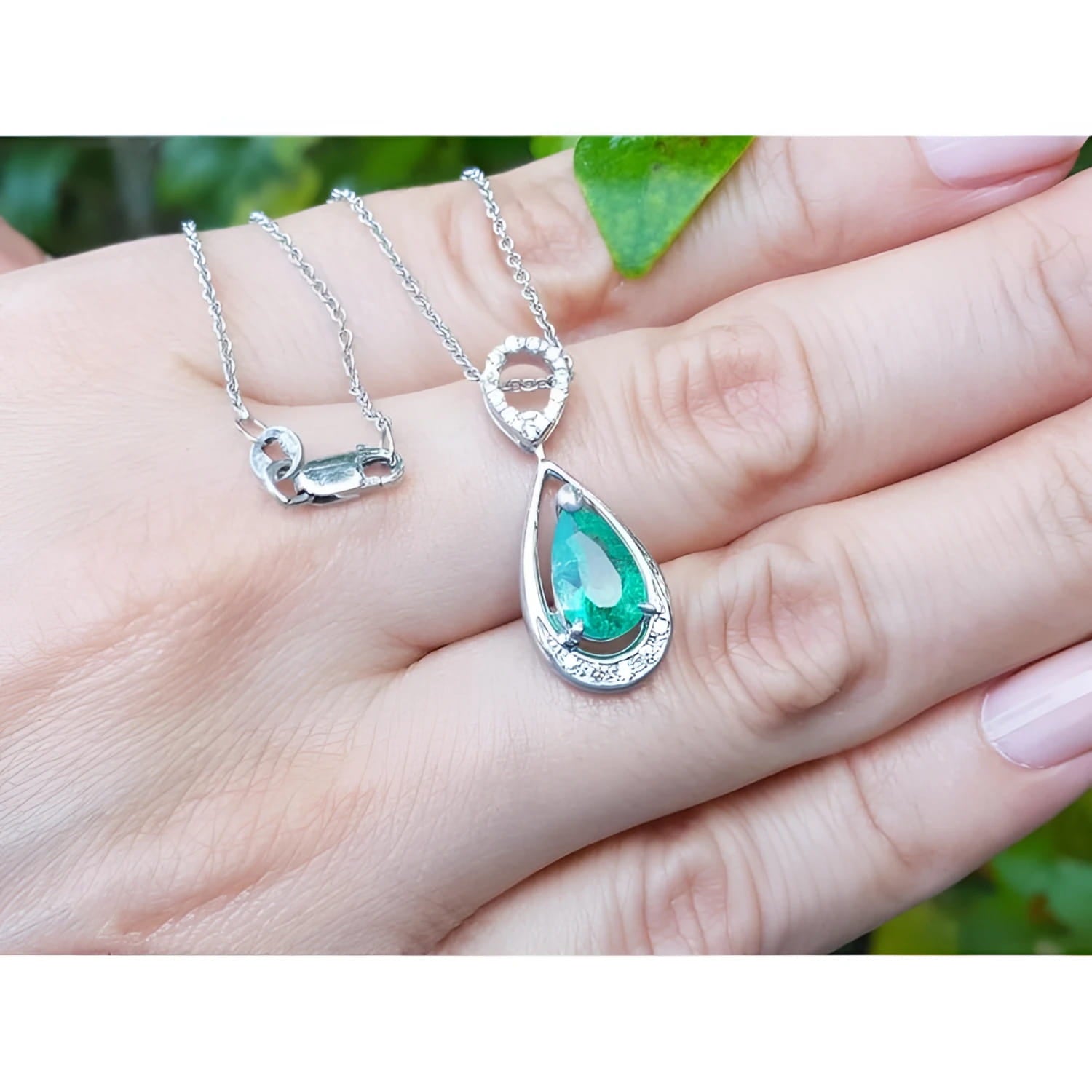 1.35 ct. natural emerald pear pendant necklace in 14K white gold with diamond bail.
