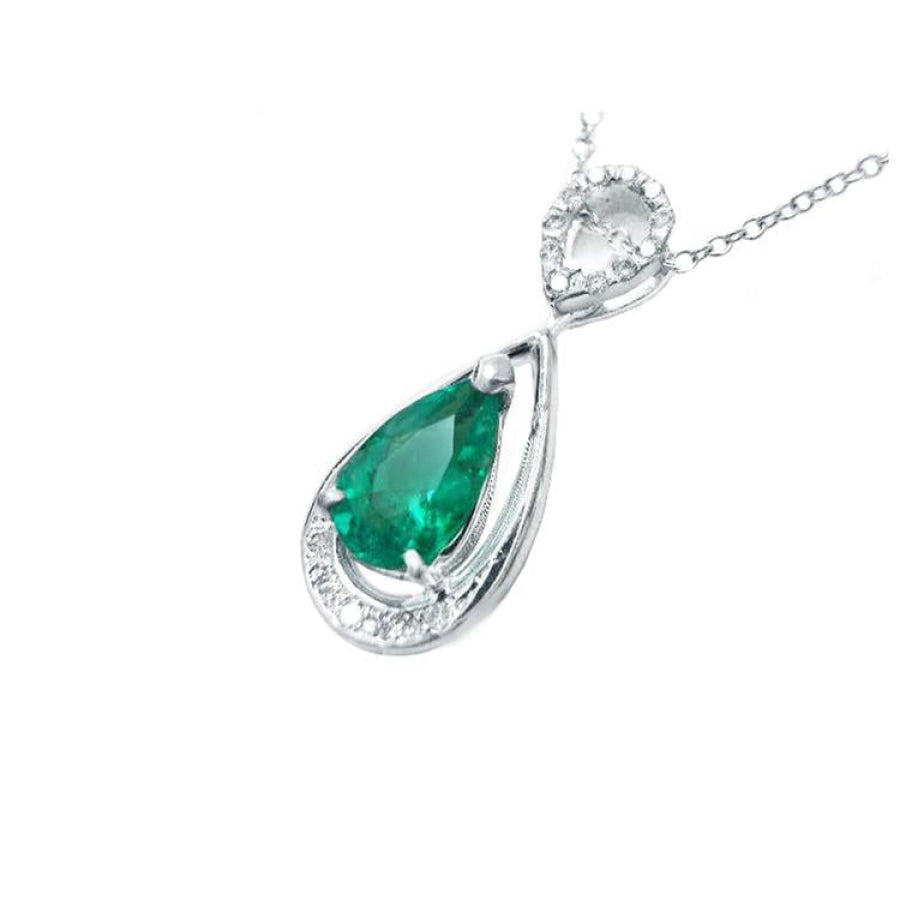 1.35 ct. natural pear-shaped emerald pendant in 14K white gold with diamond accents.