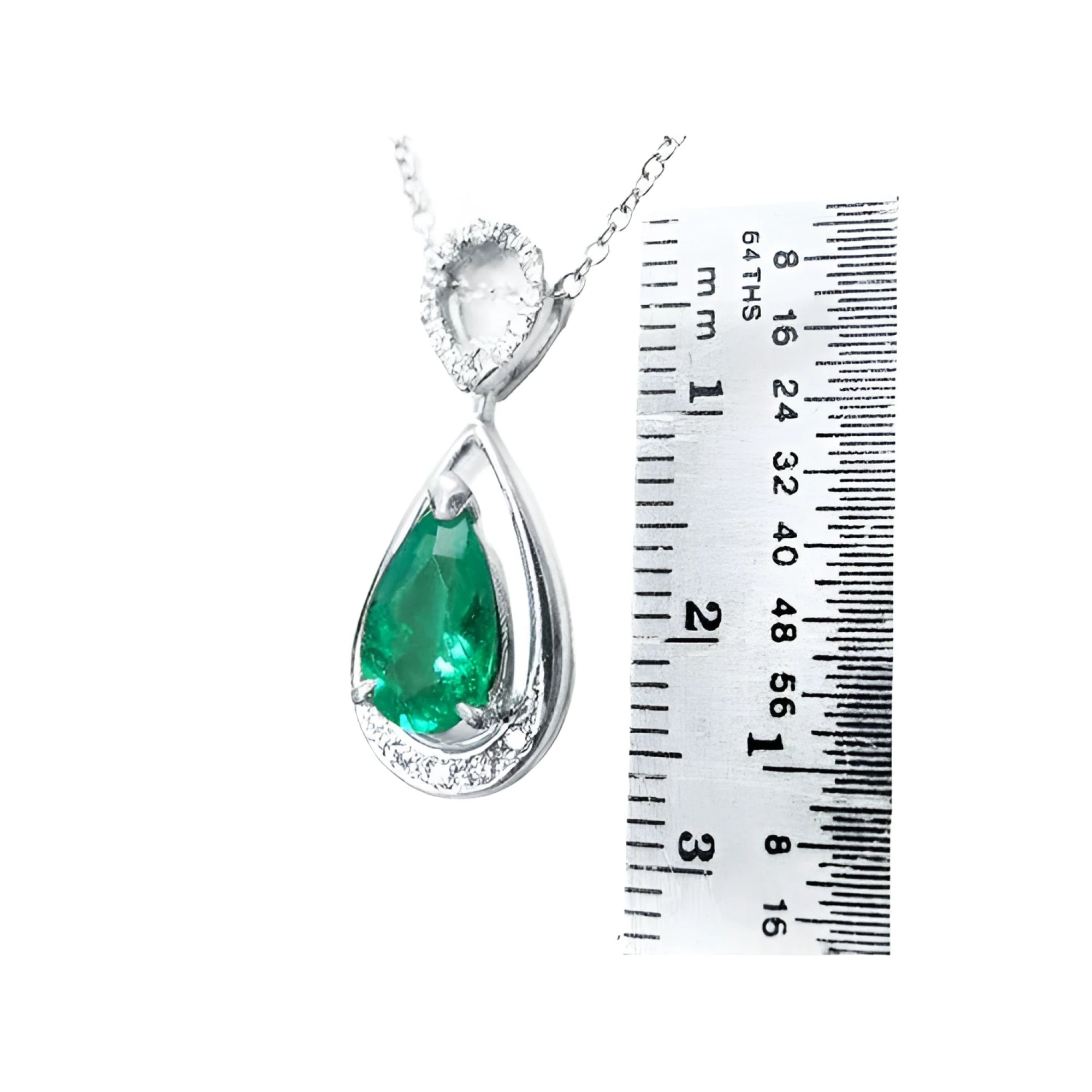 1.35 ct natural pear-shaped emerald pendant necklace with diamond bail in 14K white gold, shown with ruler.
