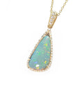 Opal pendant necklace on a gold chain left-side view with a white background