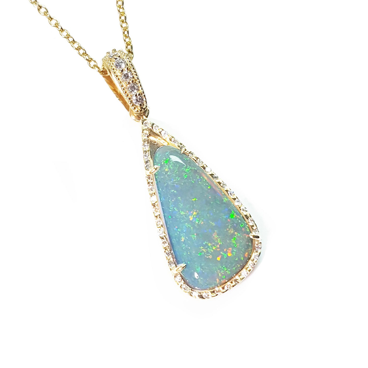 Opal pendant necklace with gold chain on a white background