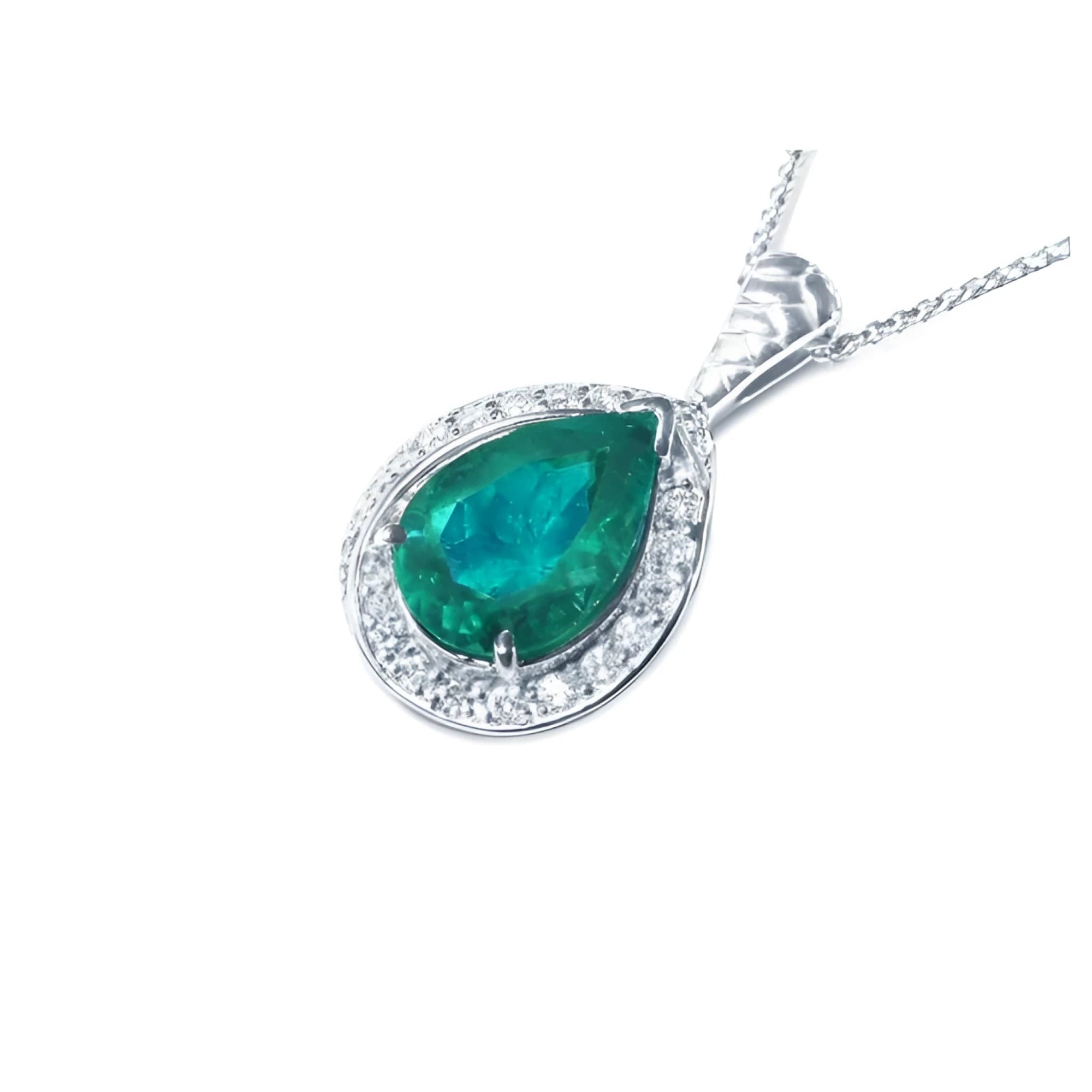 Pear-shaped natural emerald pendant with diamond halo in 14K white gold.
