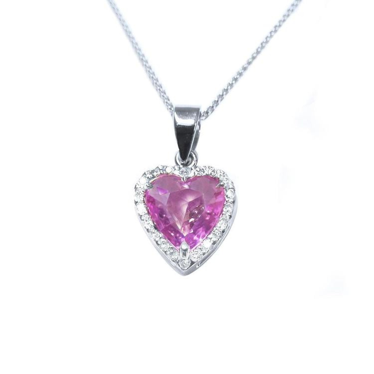 Heart-cut pink sapphire pendant with diamond halo in 18K white gold on a delicate chain.