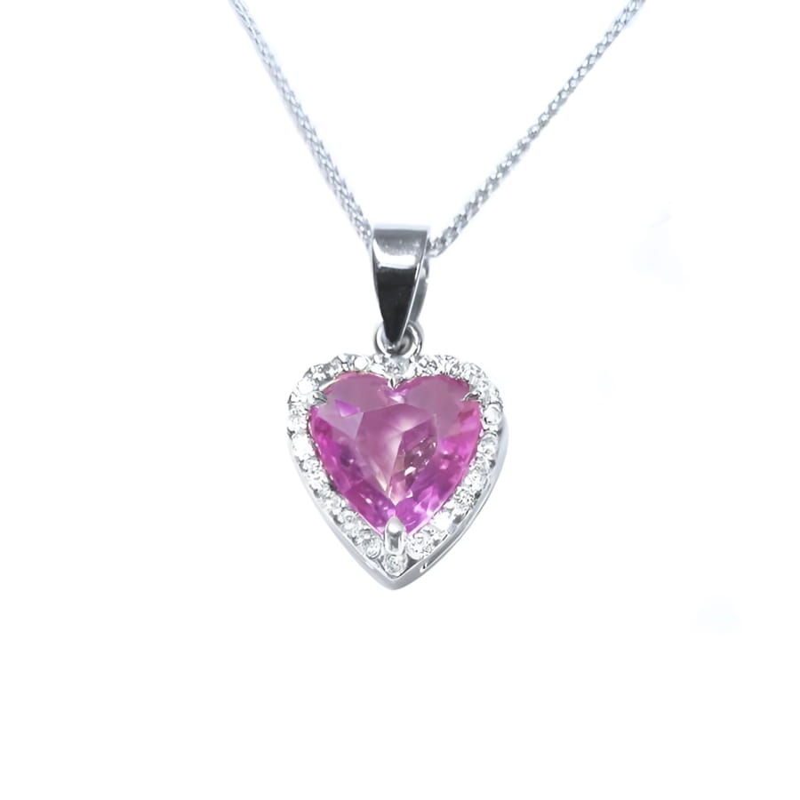 Heart-cut pink sapphire pendant with diamond halo in 18K white gold on a delicate chain.