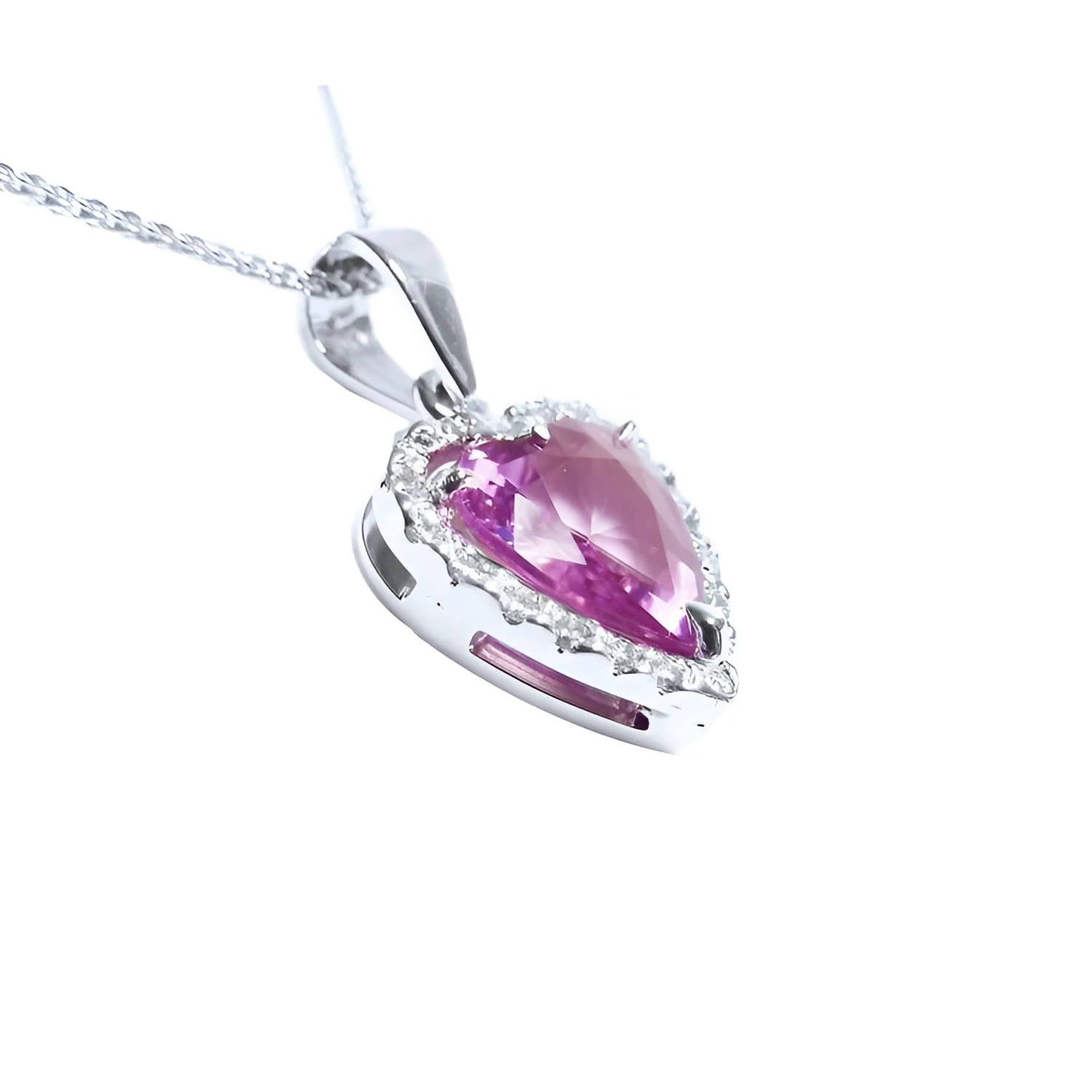 Heart-cut pink sapphire pendant with a diamond halo on an 18K white gold chain.