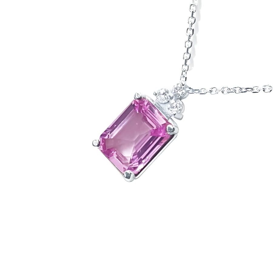 2.01 ct. natural pink sapphire emerald cut necklace in 14K white gold with diamond accents.