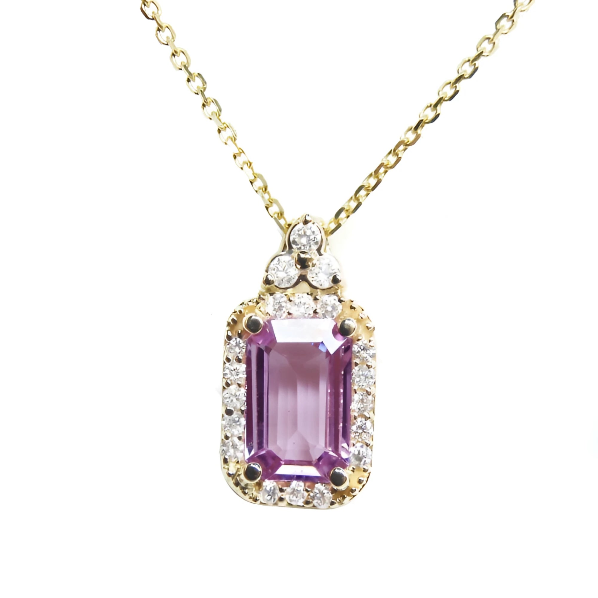Natural pink sapphire necklace pendant rectangular emerald cut in a medium light hue, surrounded by a halo of natural diamonds and set in 14k gold.