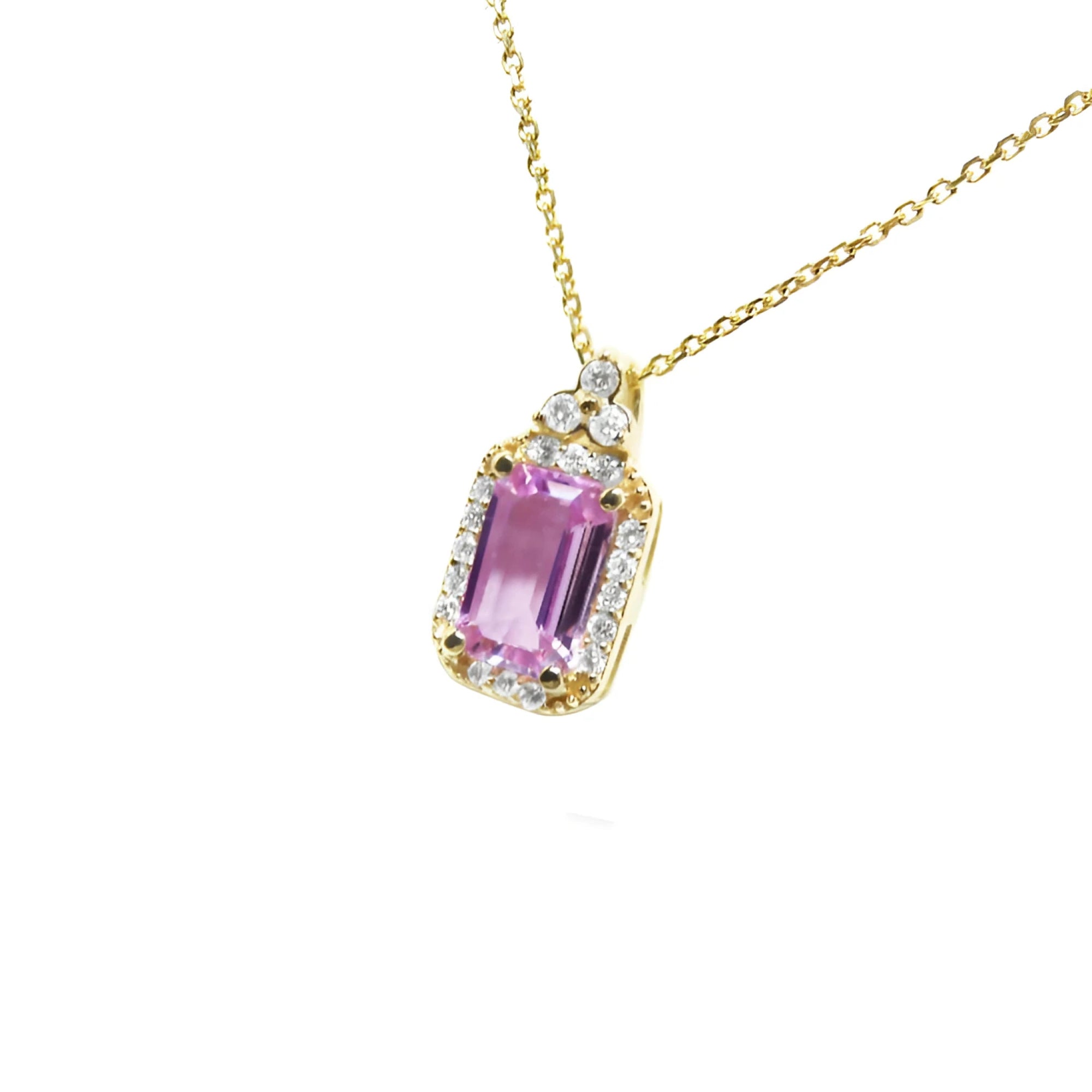 Natural pink sapphire necklace sparkling rectangular emerald cut surrounded by a halo of natural diamonds and set in 14k gold.
