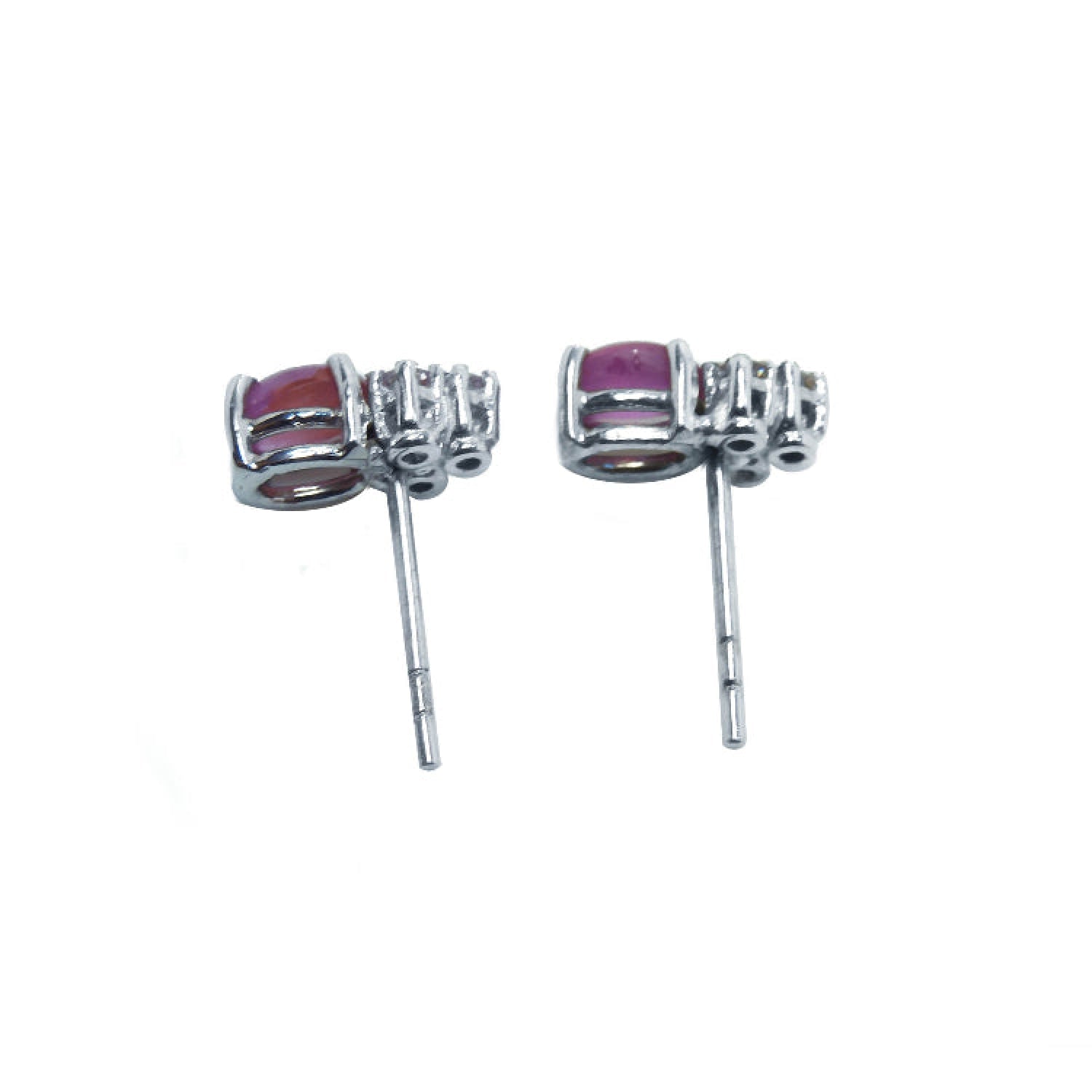 Natural pink sapphire cabochon oval cut stud earrings, prong set in 14k white gold.