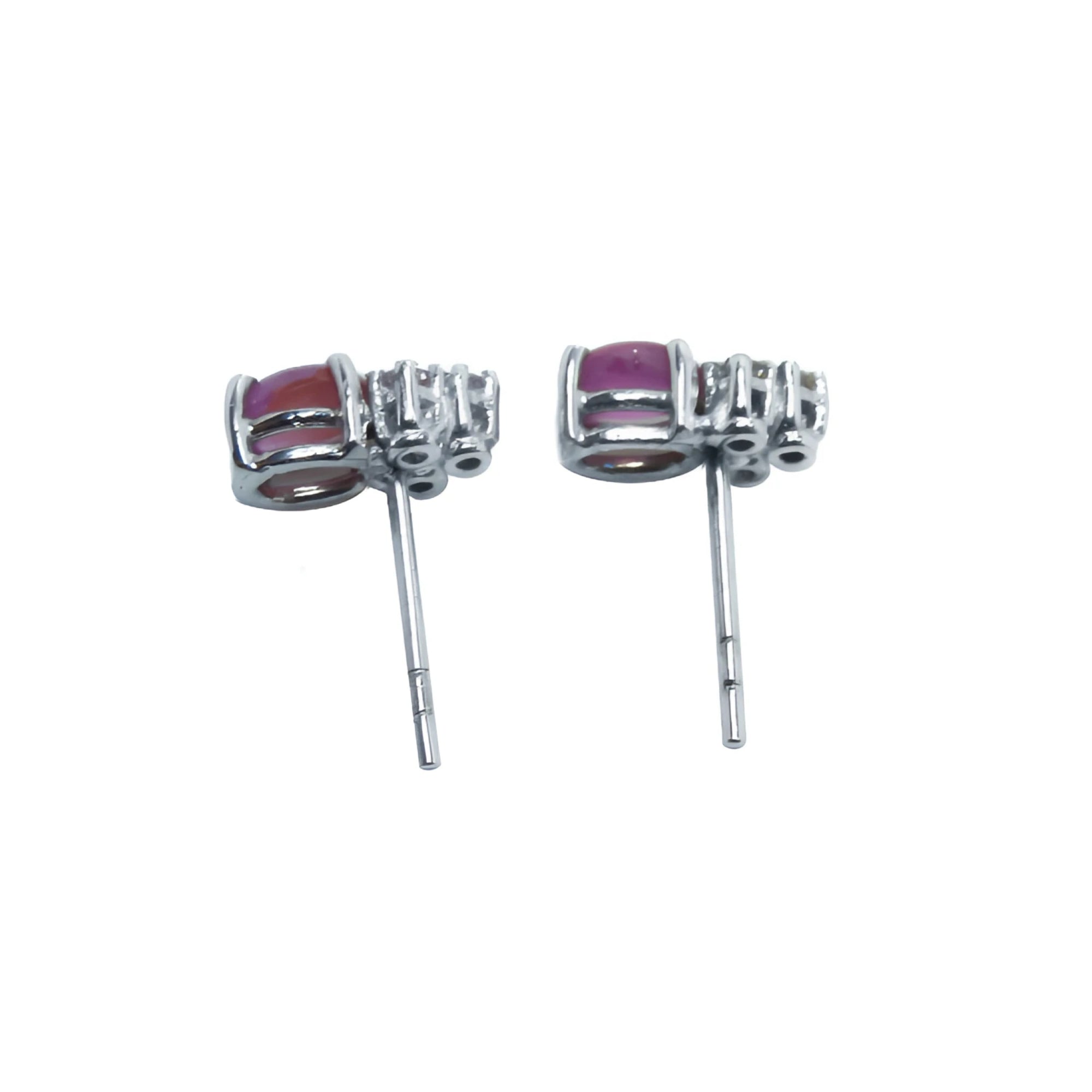 Natural pink sapphire cabochon oval cut stud earrings, prong set in 14k white gold.