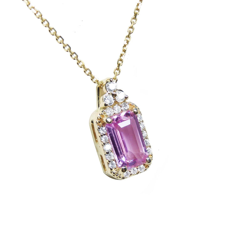 For sale: natural pink sapphire necklace pendant, surrounded by a halo of natural diamonds and set in 14k gold.