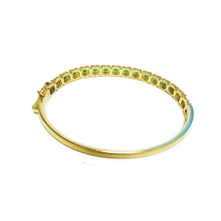14K gold bangle bracelet with round brilliant cut bluish-green emeralds in square links with rope borders.