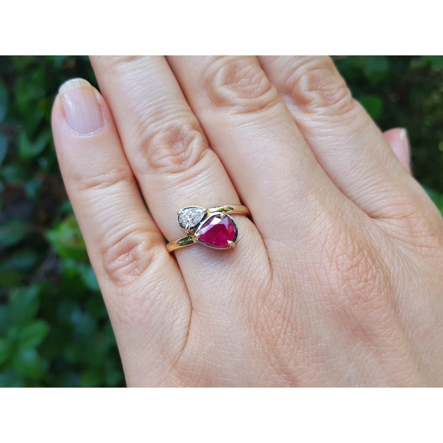 Natural You and Me Ruby Diamond Ring 18K Gold This two stone features a 1.02 ct Burma accentuated by teardrop side